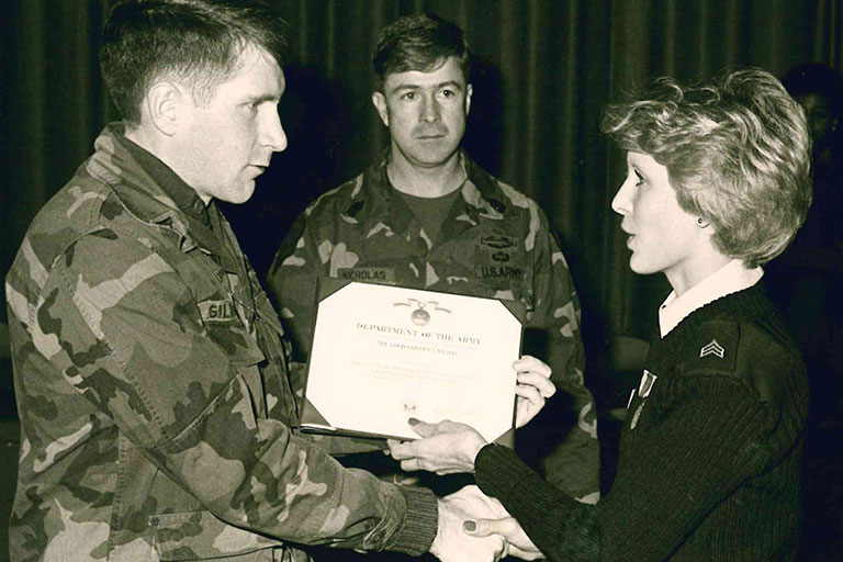 Gretchen Leigh, an executive secretary at ENMU, receiving one of five Army Achievement Medals.