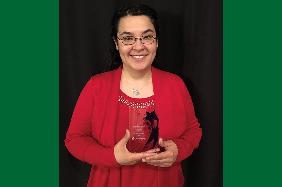 Ernestina "Tina" Guzman with her "Adventurer Award" from Blue Layer in 2018
